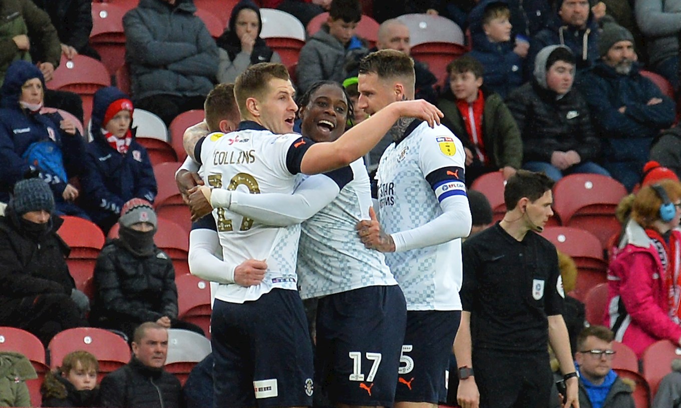 Ryan Tunnicliffe is mobbed by his team-mates after netting the Town's winner at Middlesbrough