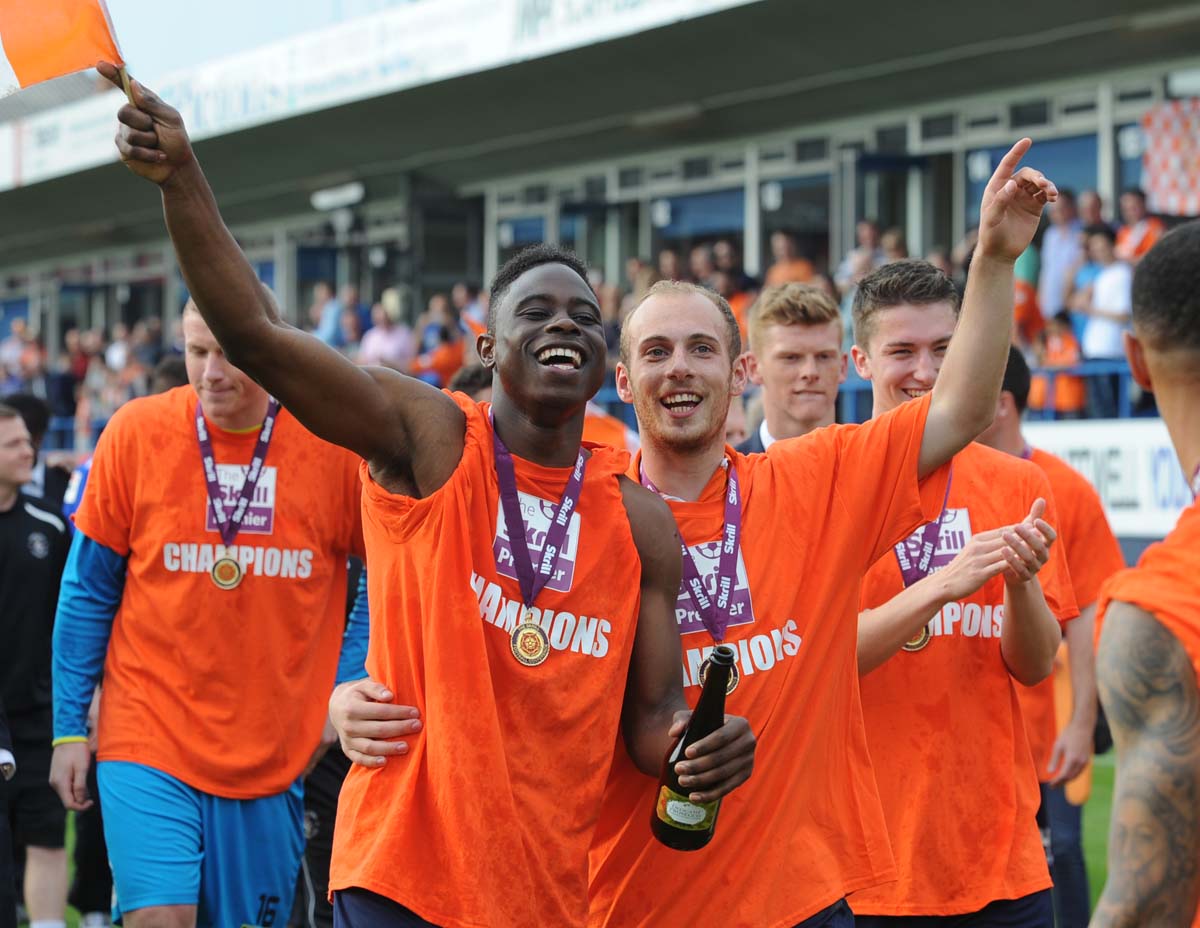 Mpanzu (left) celebrating winning the Conference in 2014.