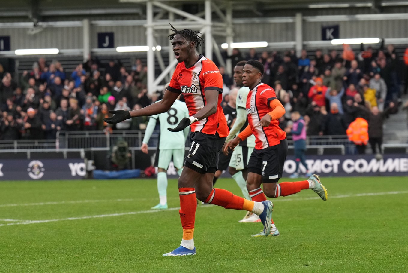 Elijah Adebayo hyping the crowd up after scoring Luton's second goal against Chelsea.