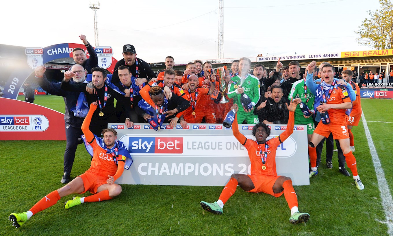 Berry celebrates the League One title win with his Hatters team-mates in 2018-19