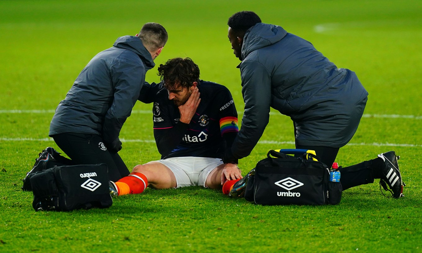 Tom Lockyer being treated for his back injury at Brentford last weekend.