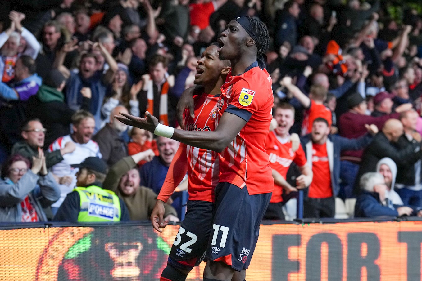 Gabe Osho celebrating his goal in the Championship play-off semi-final second leg against Sunderland at Kenilworth Road with Elijah Adebayo.