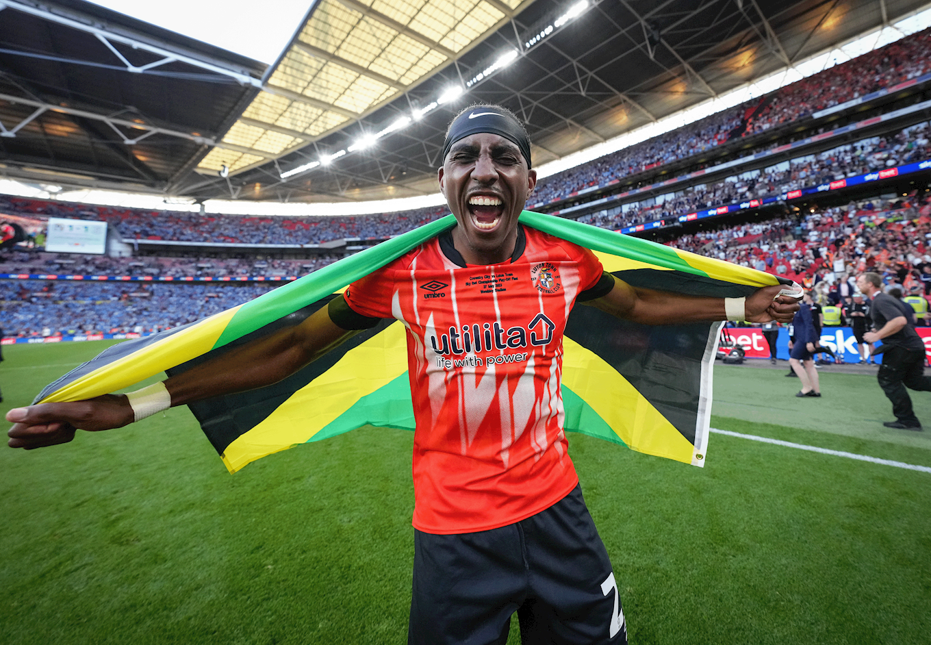 Amari'i Bell celebrating at Wembley Stadium with his Jamaican flag.