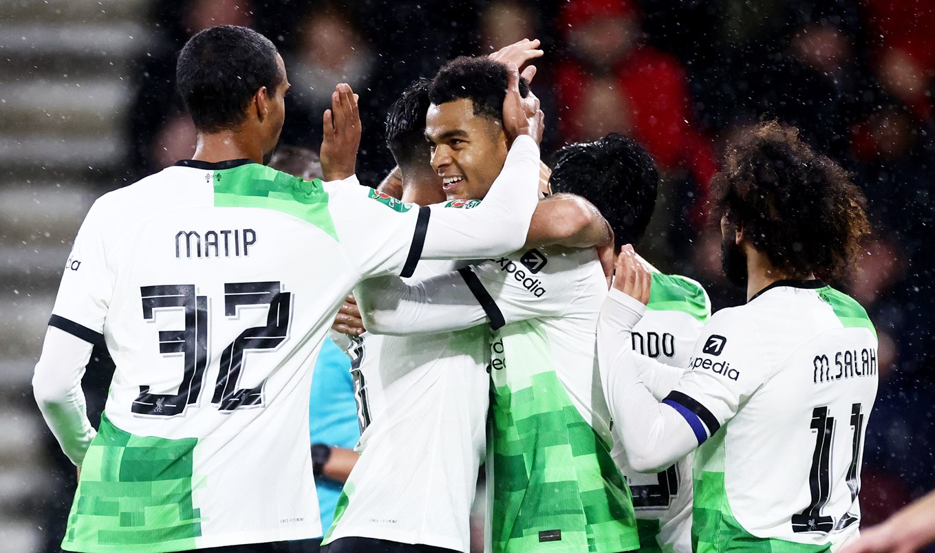 Cody Gakpo celebrating his goal at Bournemouth with his teammates.