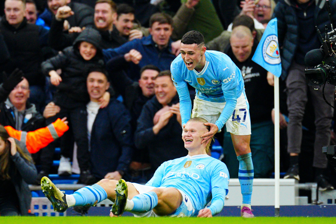 Erling Haaland celebrating his goal against Manchester United with Phil Foden.