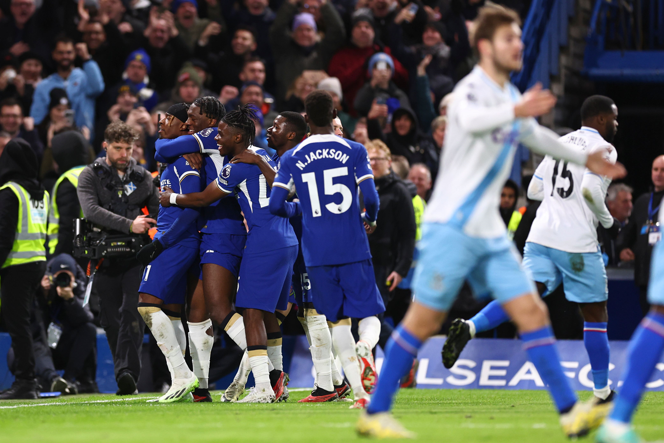 Noni Madueke celebrating his winner against Crystal Palace with his teammates.