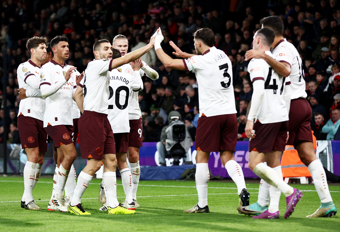 Man City players celebrating Phil Foden's winner at Bournemouth.