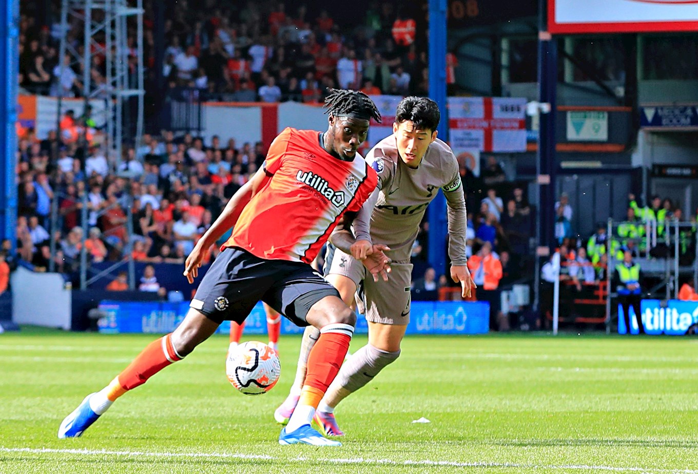 Hatters striker Elijah Adebayo in action against Tottenham captain Son Heung-Min