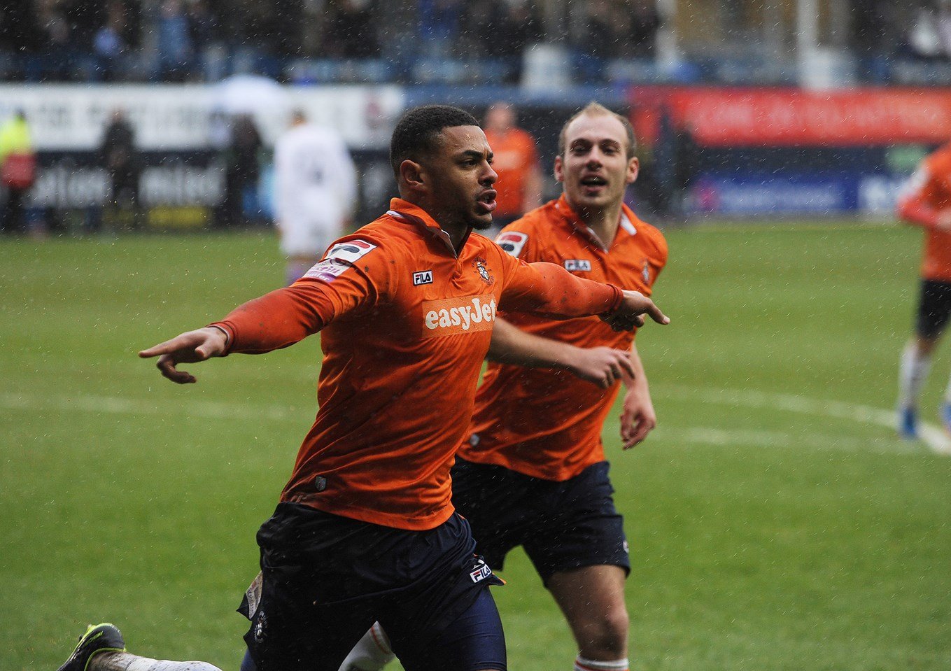 Andre Gray celebrating one of his goals with Jake Howells.