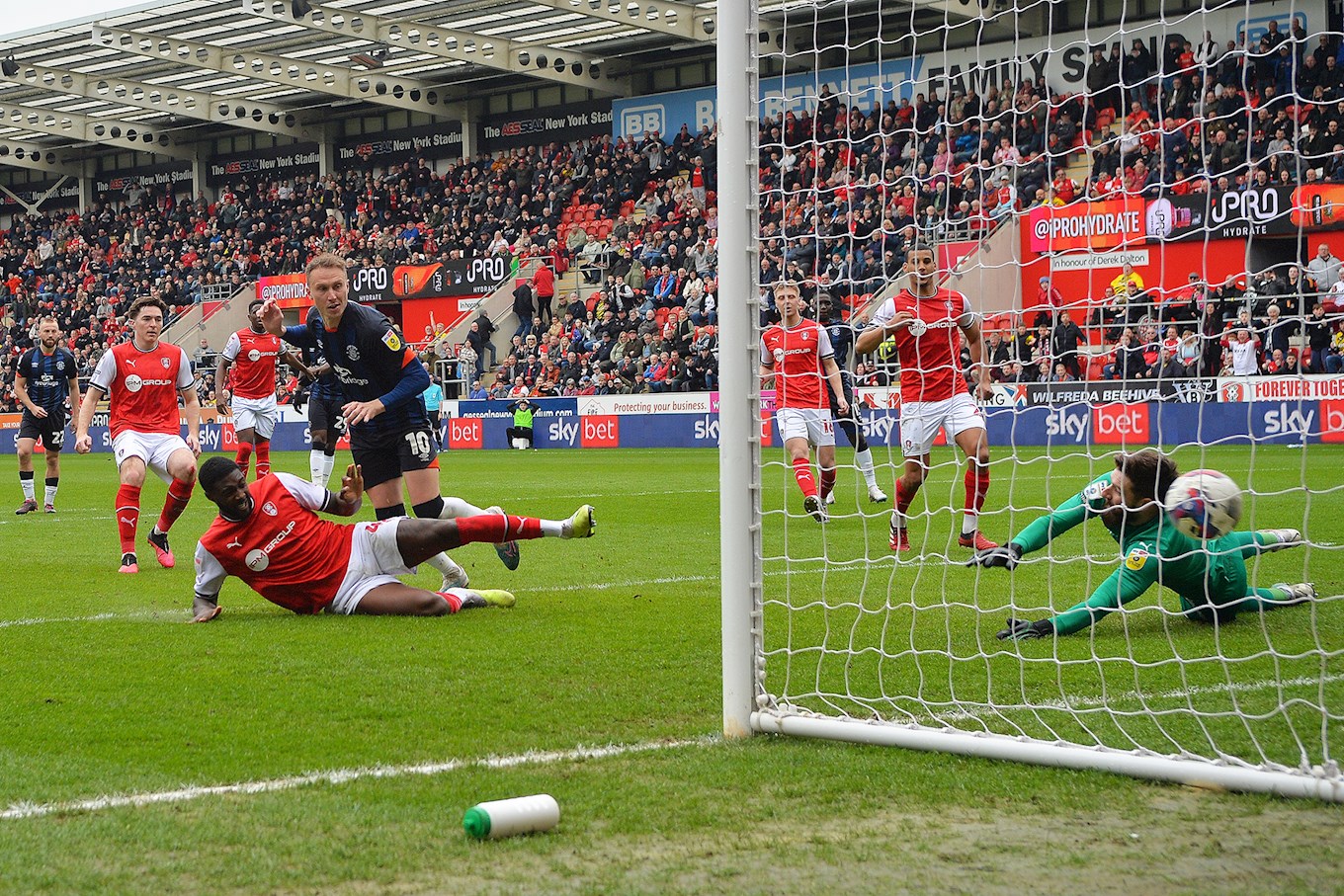 Cauley Woodrow scores from the rebound after his penalty was saved at Rotherham