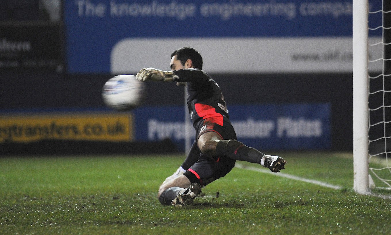 Hatters keeper James Shea tried in vain to keep out Peterborough's penalties in the Posh's shoot-out win