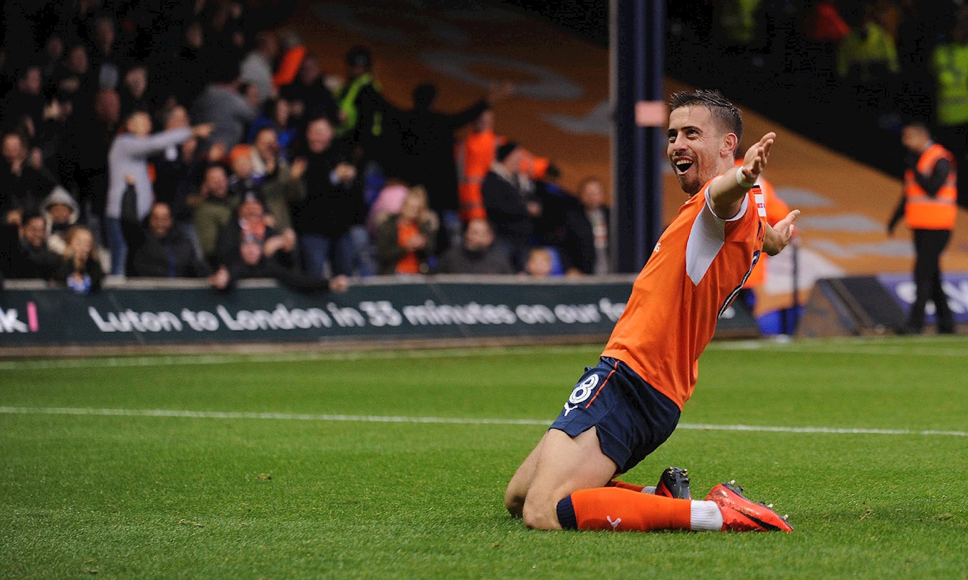 Olly Lee slides on his knees in celebration of his 70-yard strike against Cambridge