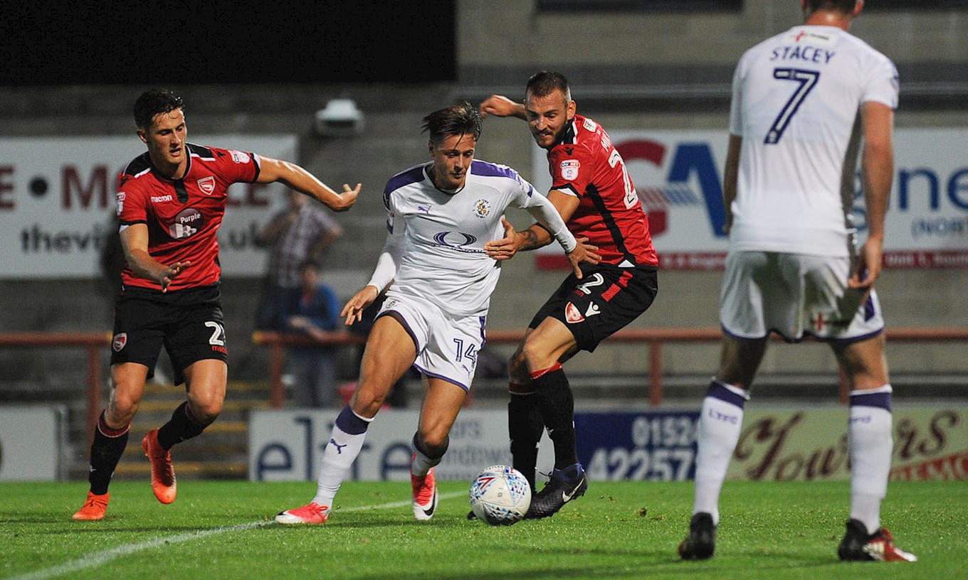 Hatters forward Harry Cornick takes the attack to the Morecambe defence on his first start for the club
