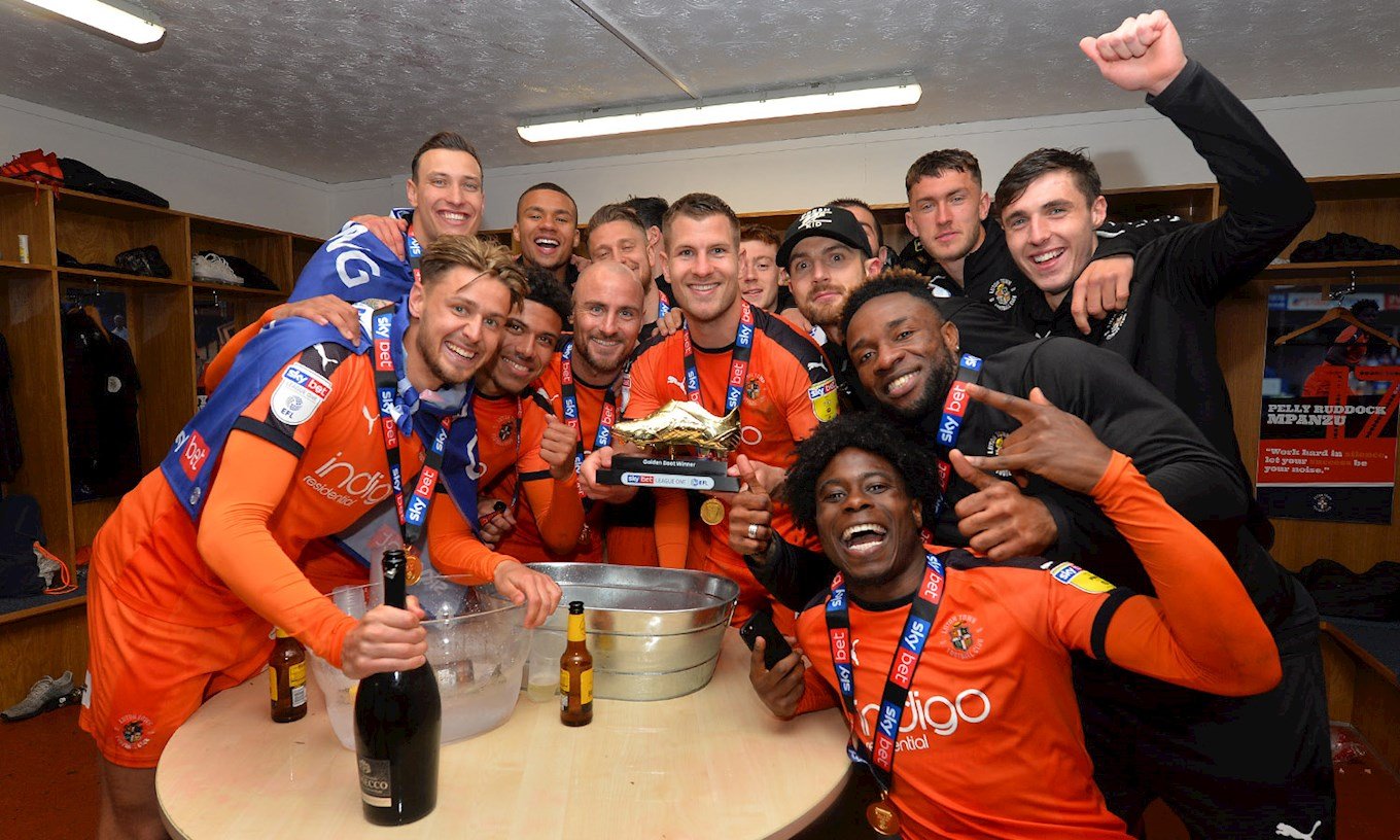 James Collins celebrates the League One title with his Golden Boot trophy and his team-mates at the end of the 2018-19 season