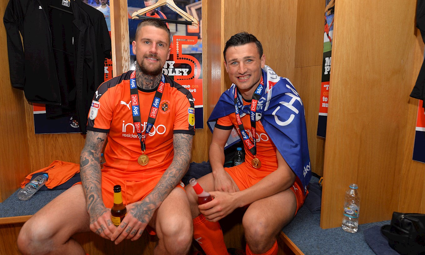 Matty Pearson and Sonny Bradley celebrate promotion to the Championship as League One champions