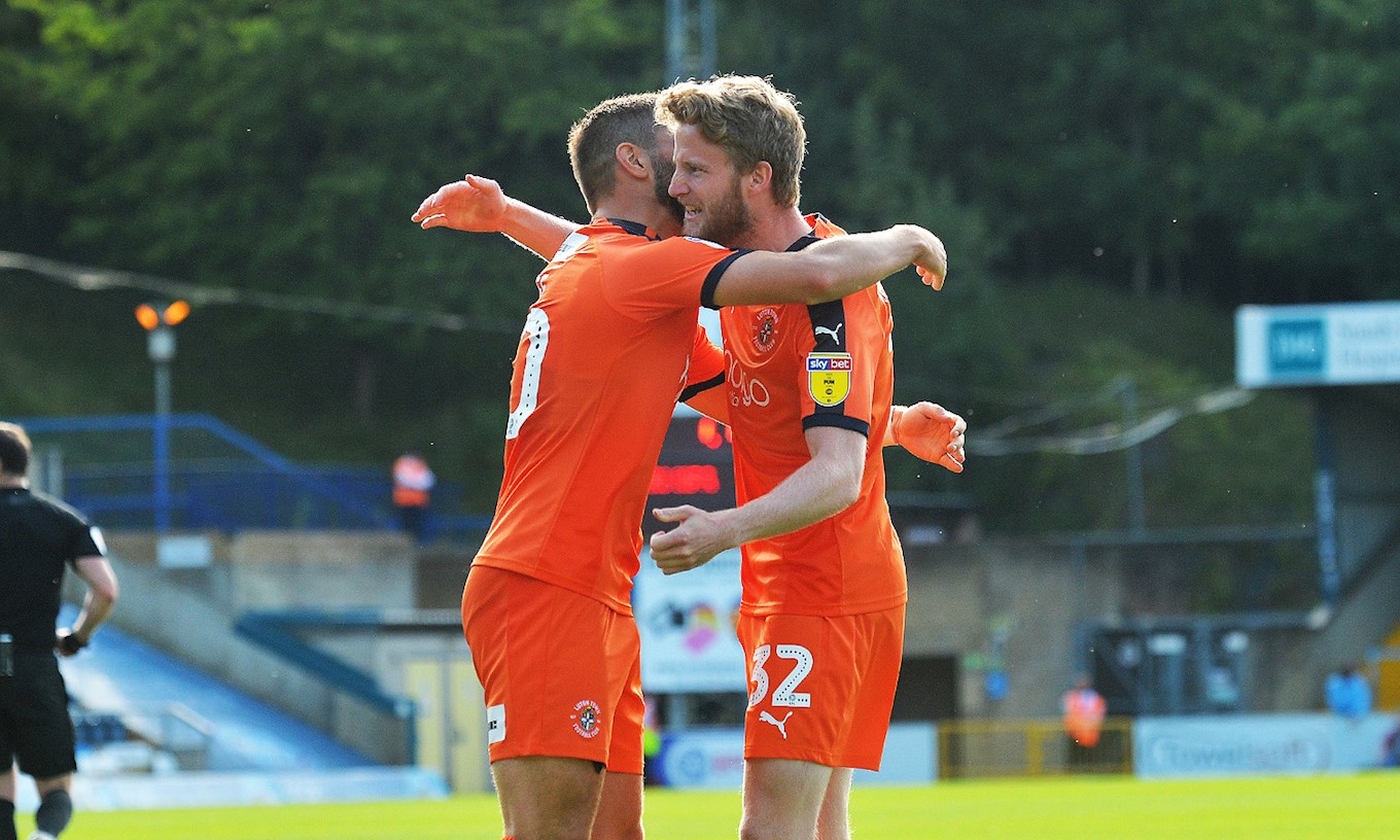 Eunan celebrates a goal at Wycombe with Elliot Lee during his first loan spell with the Hatters