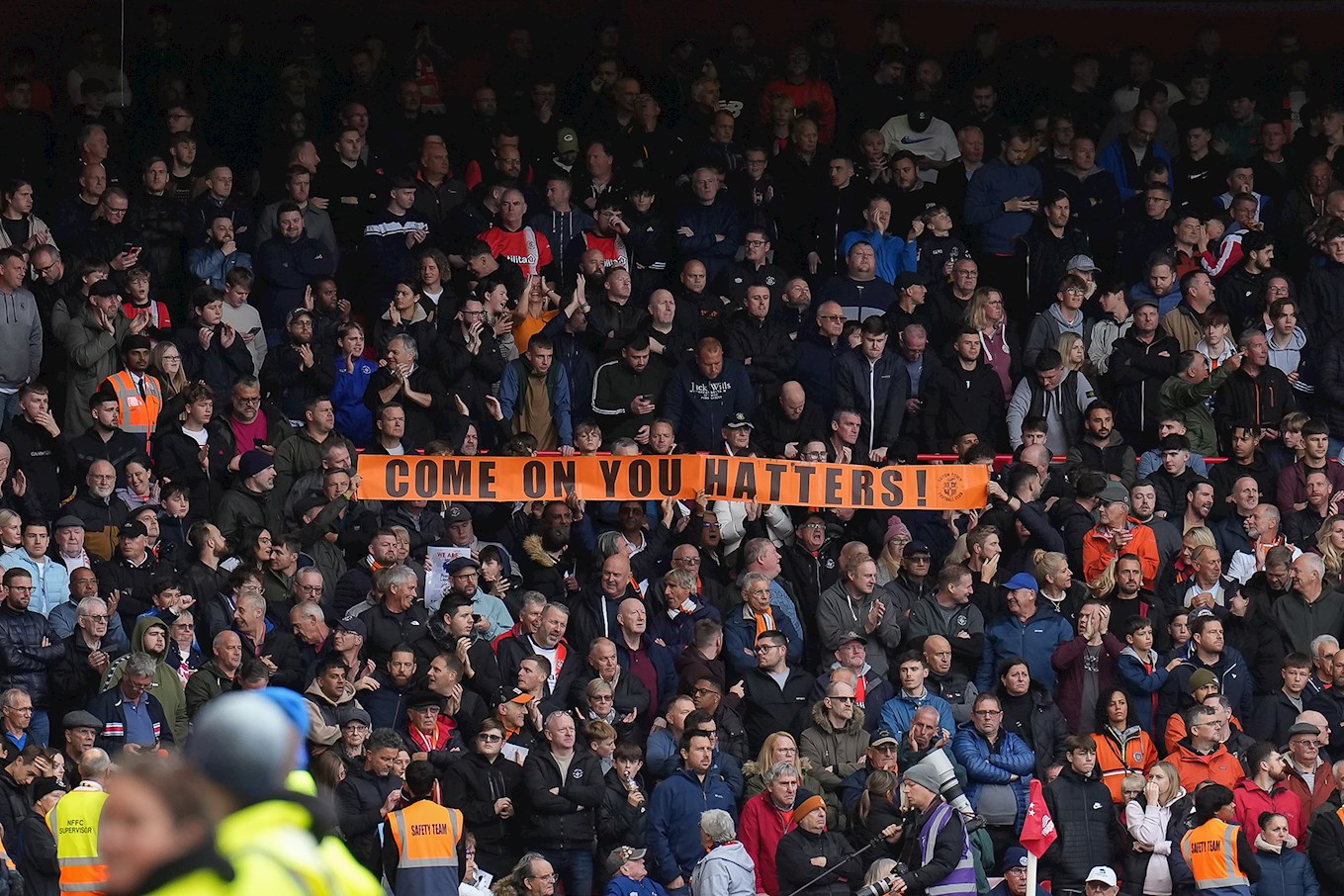Luton Town fans at Nottingham Forest holding up a banner.