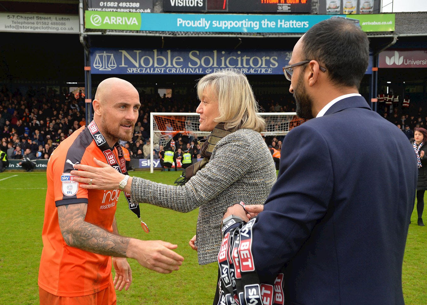 Hatters midfielder Alan McCormack receives his Sky Bet League Two runners-up medal