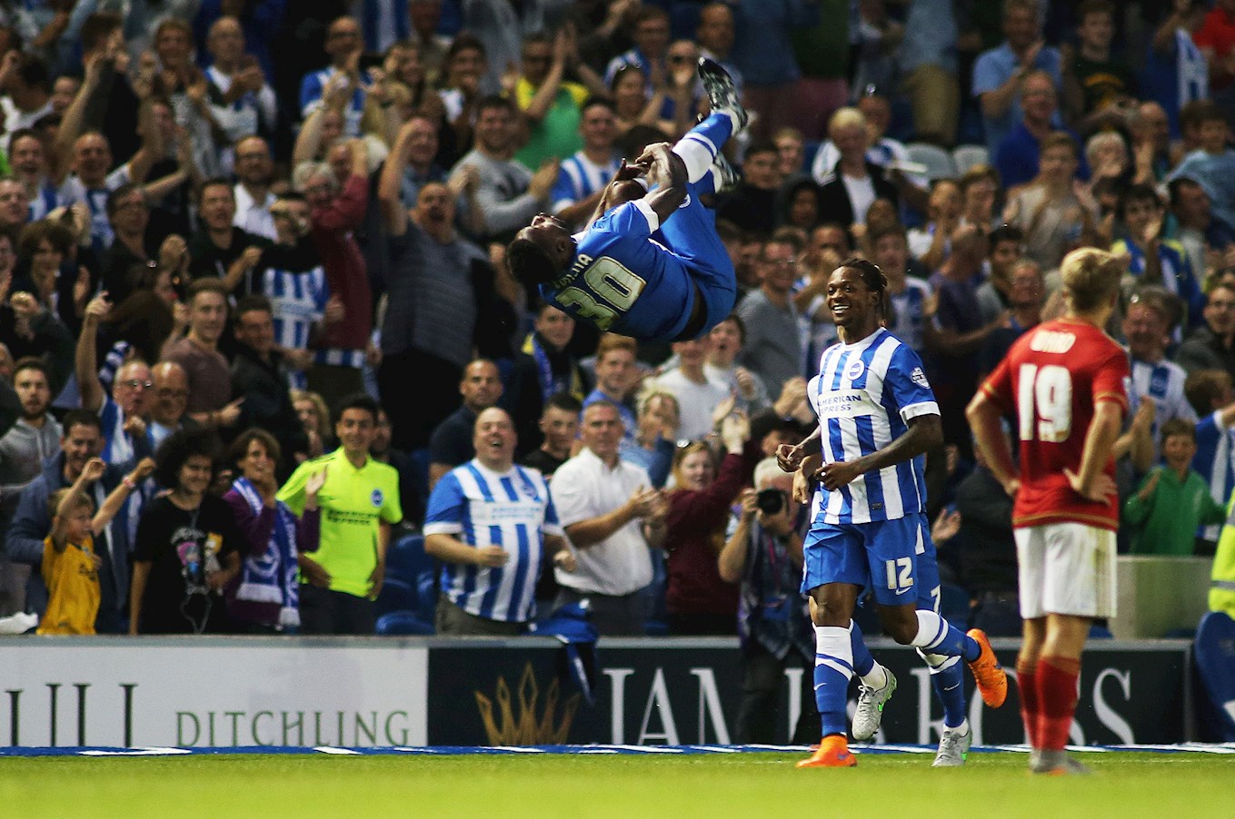 Kazenga LuaLua celebrates a goal for Brighton in acrobatic style
