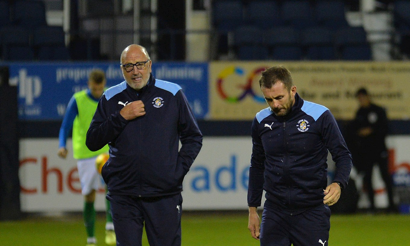 Paul Hart walks off the Kenilworth Road pitch with Nathan Jones for the final time after last night's win over Brighton Under-21s