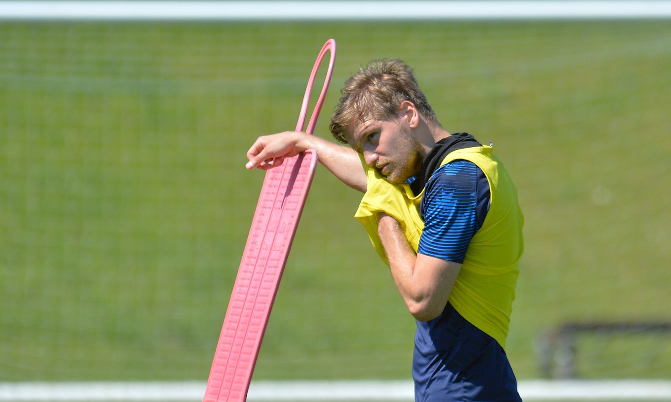 Luke Berry sweats it out in training at a sun-drenched Brache