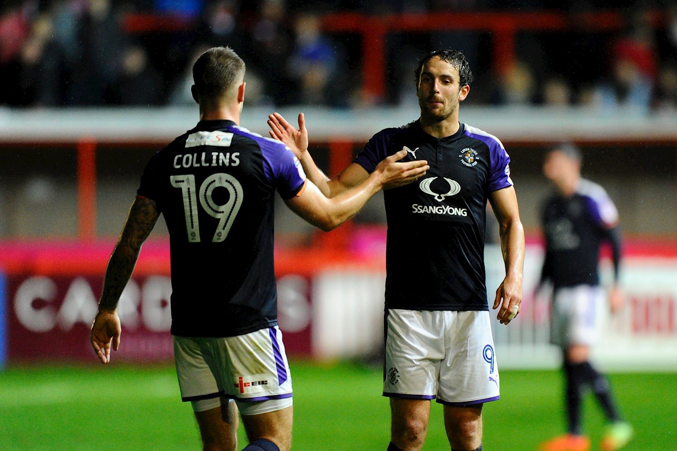Danny Hylton and James Collins celebrate a goal at Exeter in 2017-18