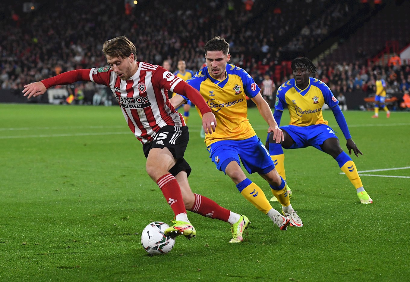 Luke Freeman in Premier League action for previous club Sheffield United