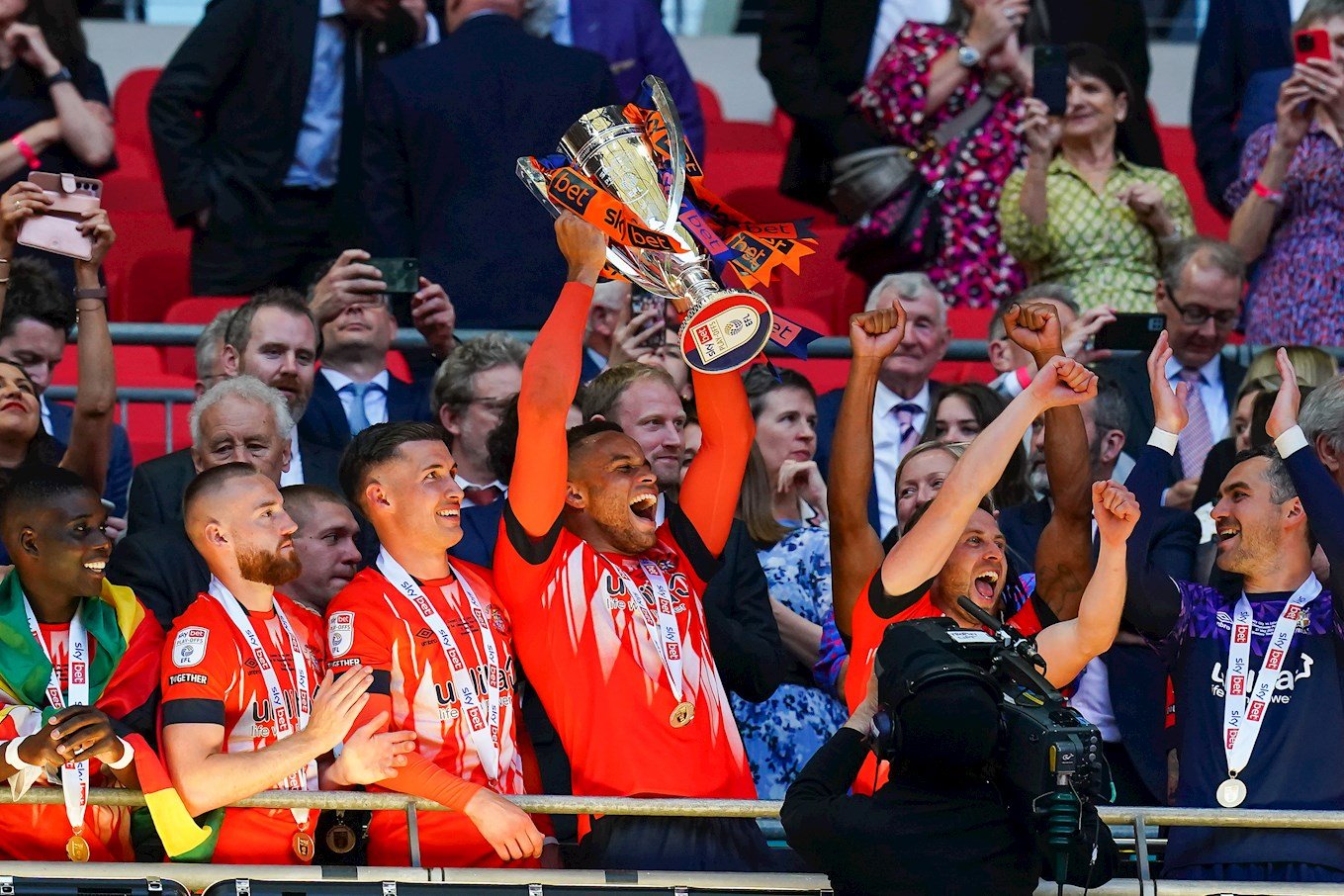 Carlton Morris lifts the Championship play-off trophy at Wembley