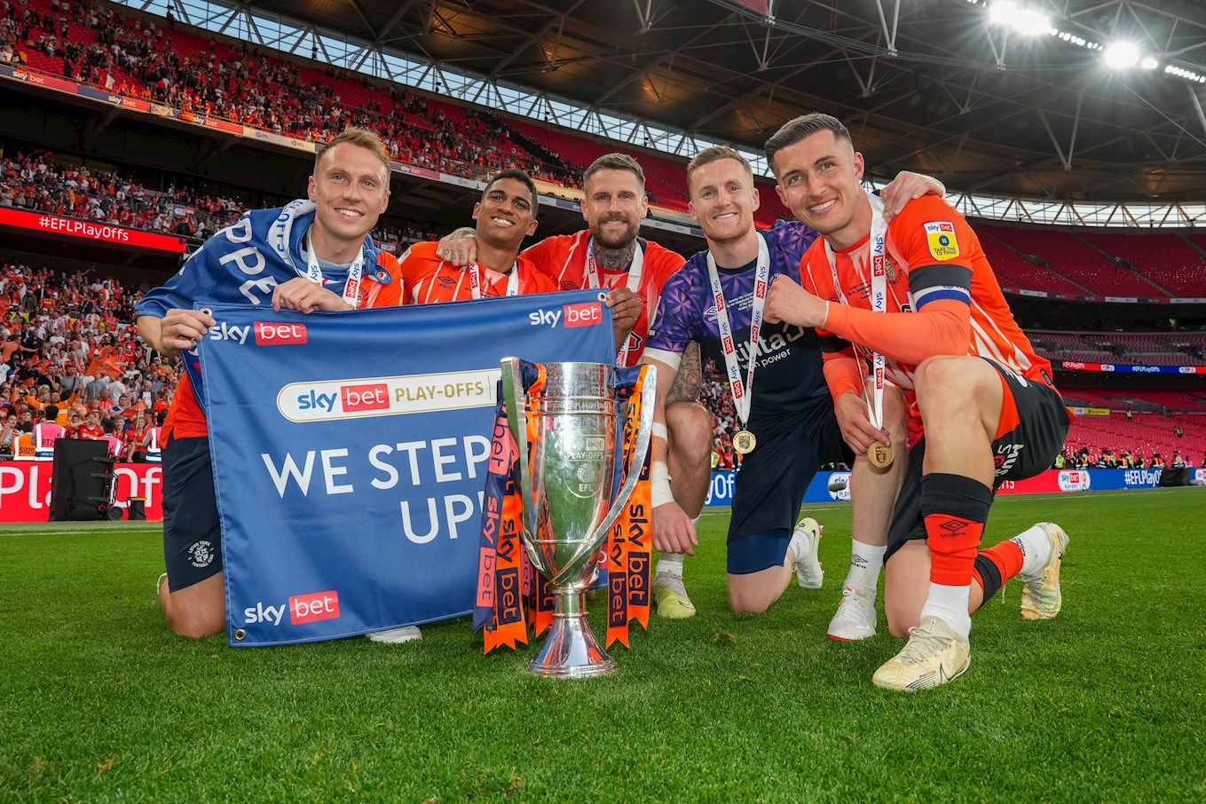 Cauley Woodrow celebrates with his team-mates at Wembley