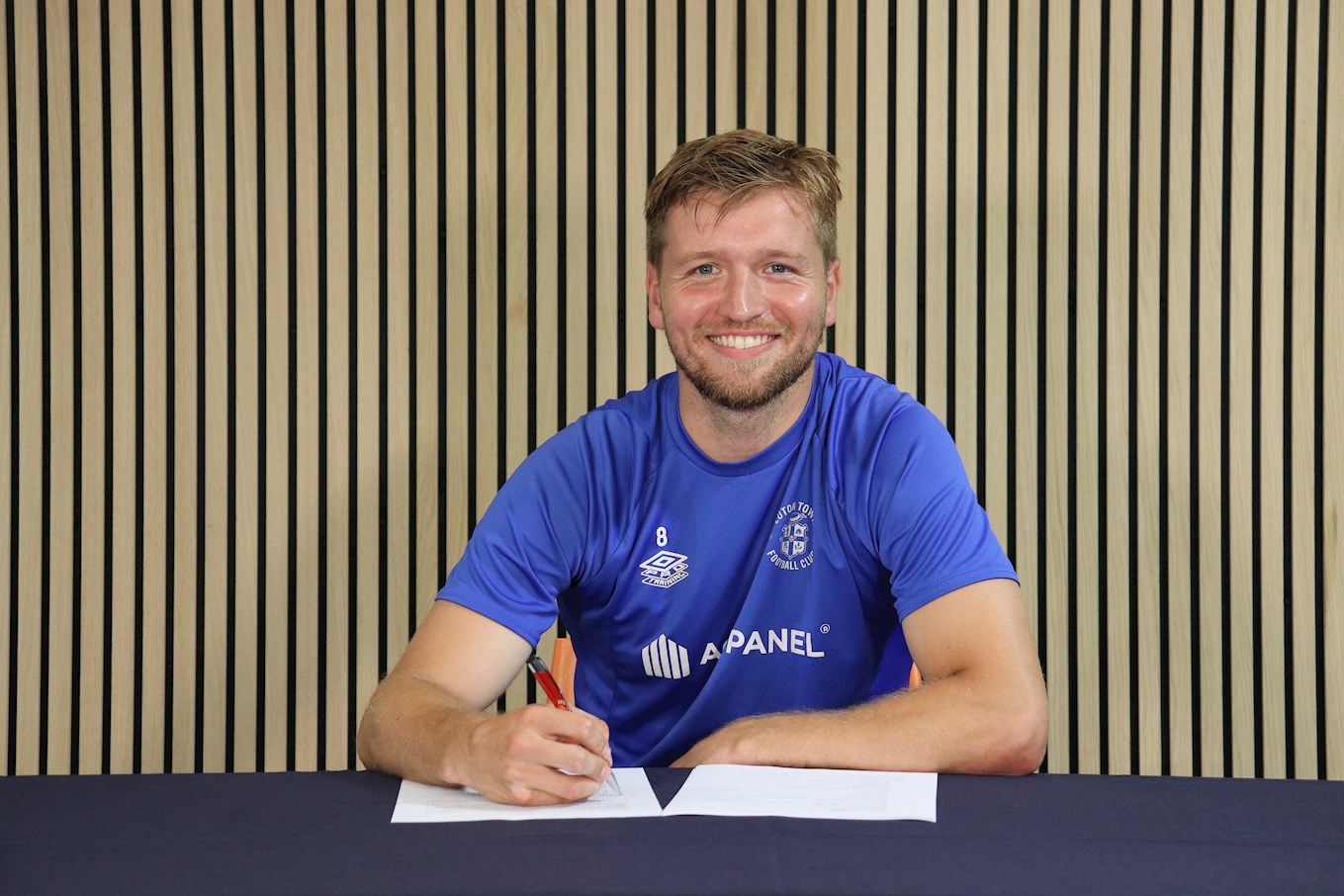 Luke Berry signs his new contract.